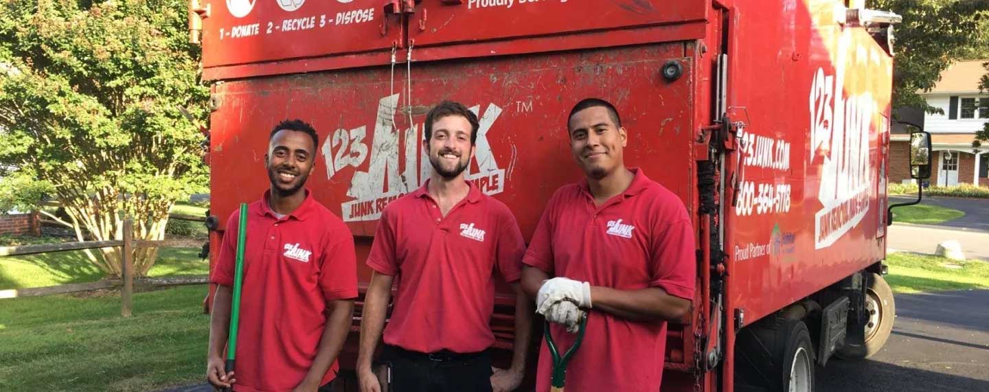 123JUNK employees next to a truck